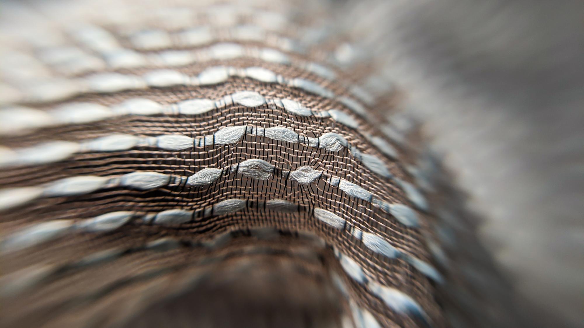 close detail of metallic thread embroidery